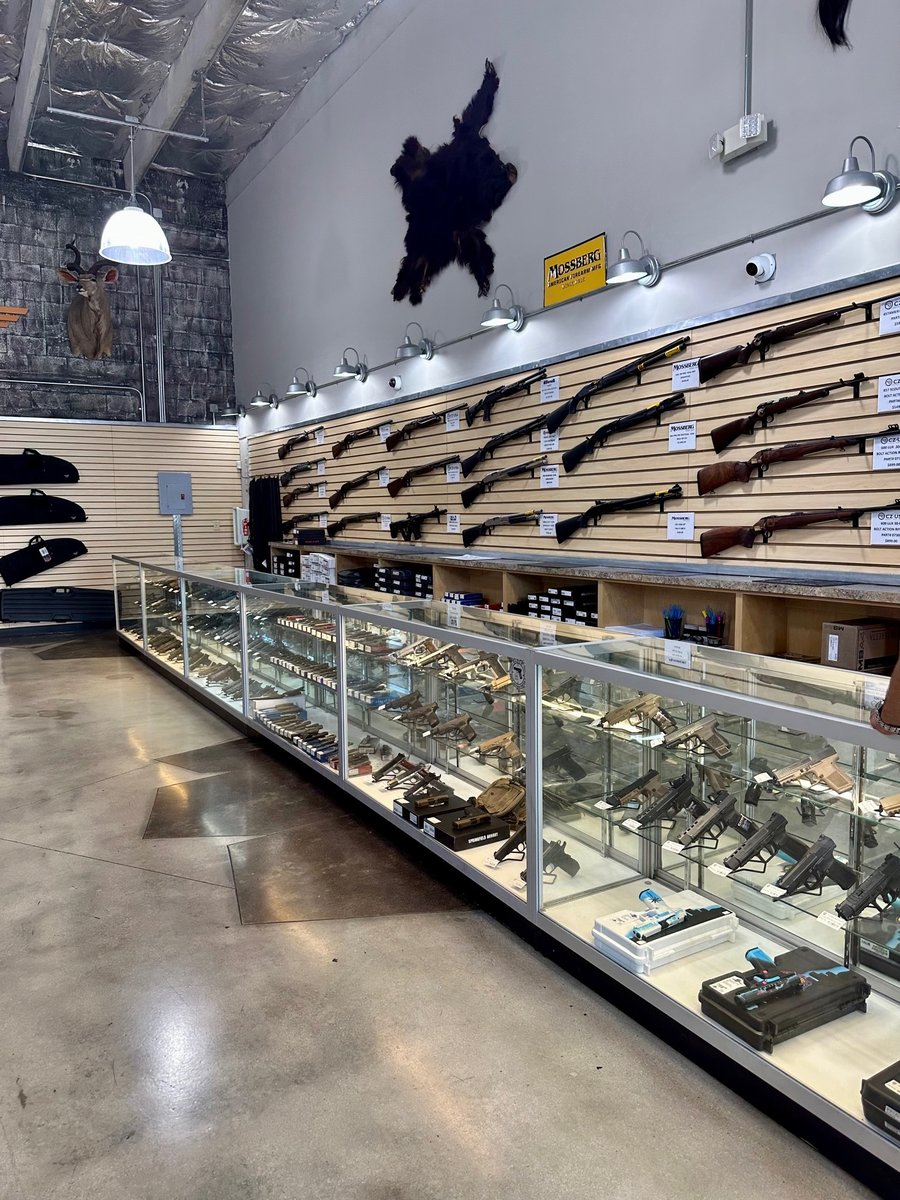 Gun Store Display Cases, Slatwall, Hooks, and Lights